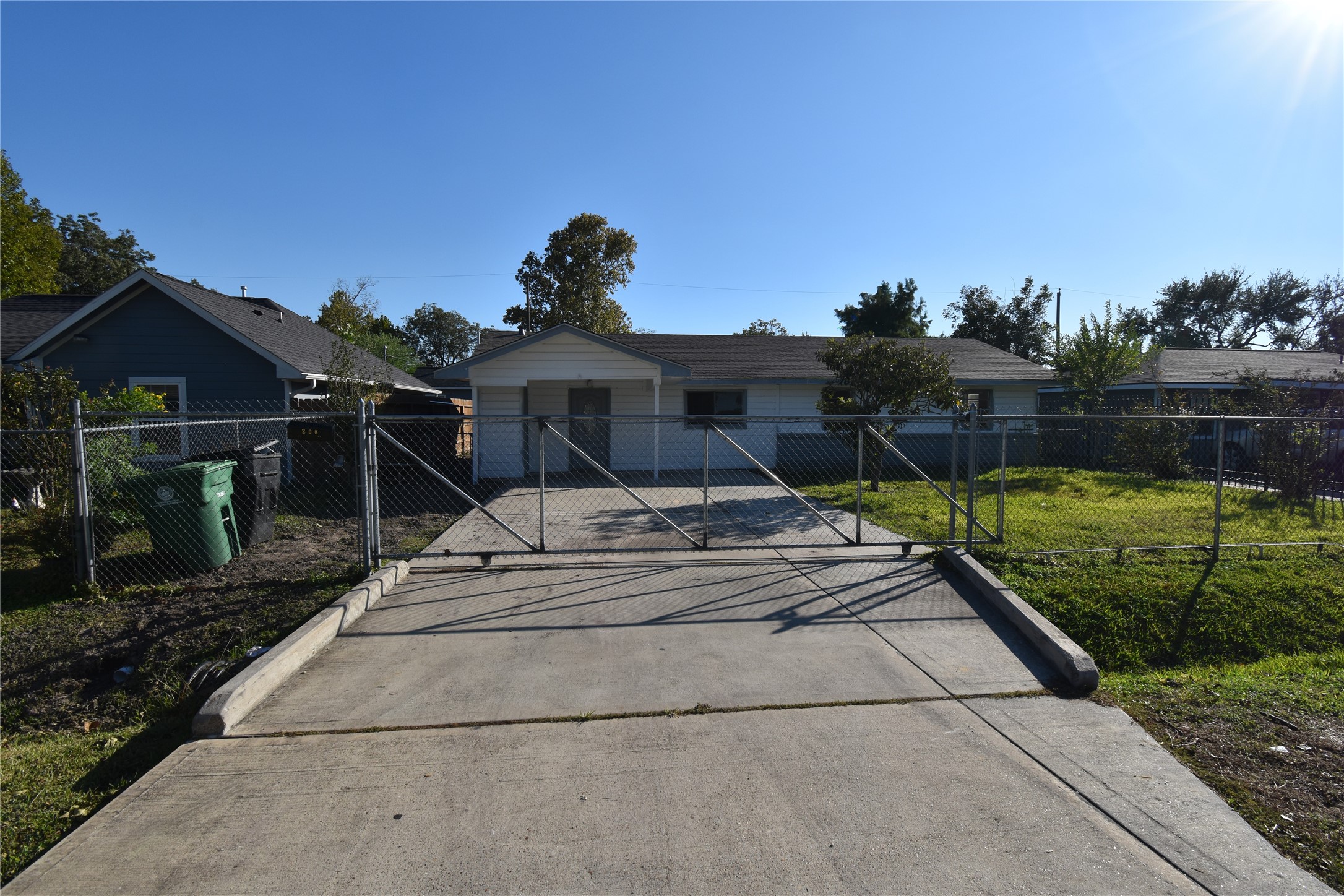 206 Arnett Lane Houston, TX 77037 - Photo 5 of 28 a front view of a house with a garden