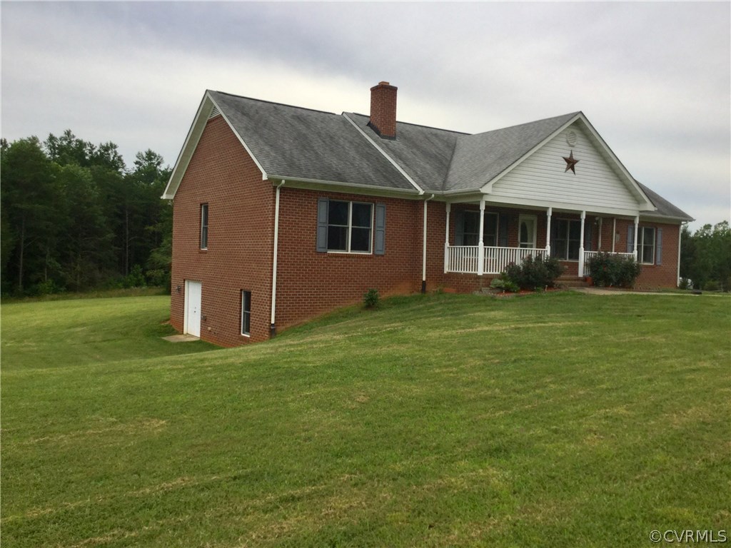 4361 Three Chopt Road Gum Spring, VA 23065 - Photo 1 of 49 a front view of a house with a garden