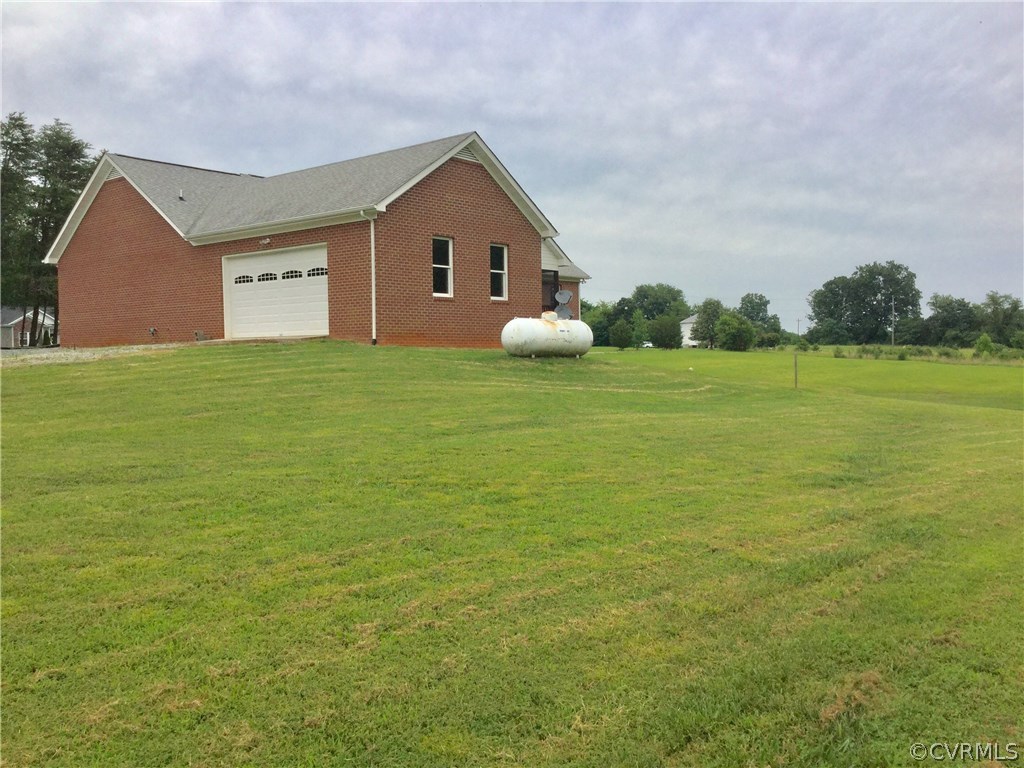 4361 Three Chopt Road Gum Spring, VA 23065 - Photo 13 of 49 a view of a house with a yard