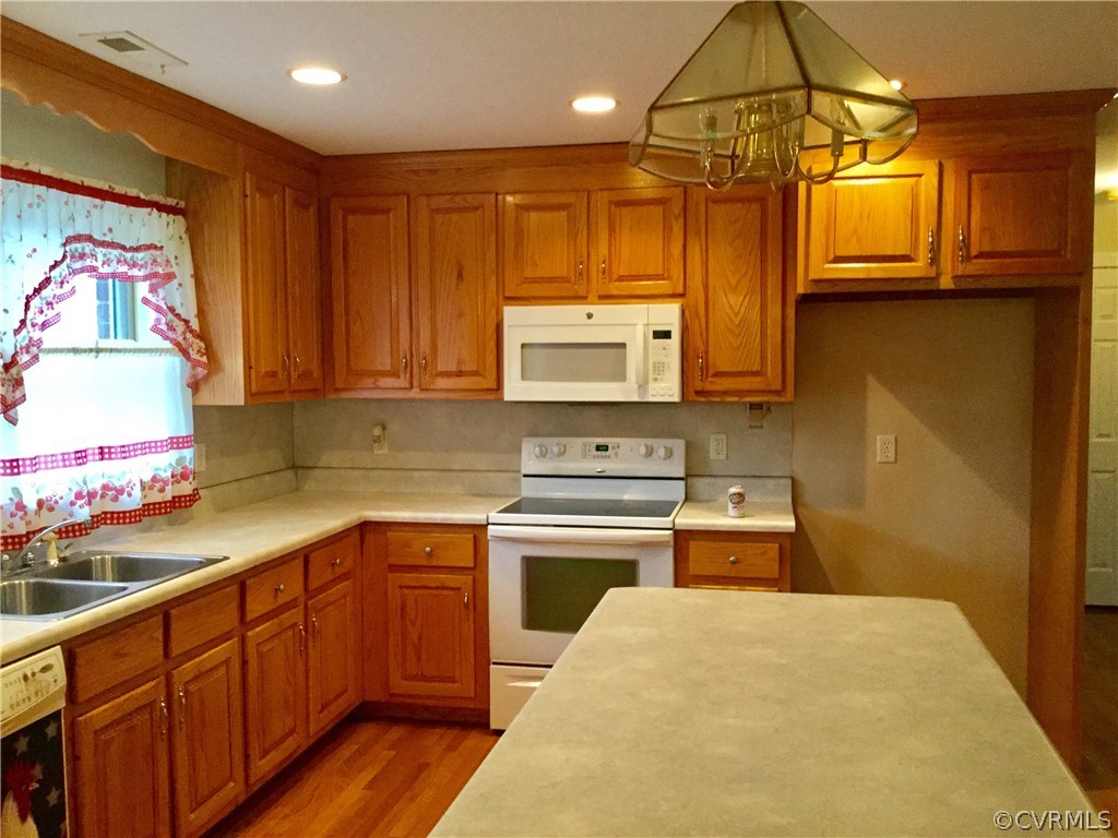 4361 Three Chopt Road Gum Spring, VA 23065 - Photo 14 of 49 a kitchen with a sink cabinets and window