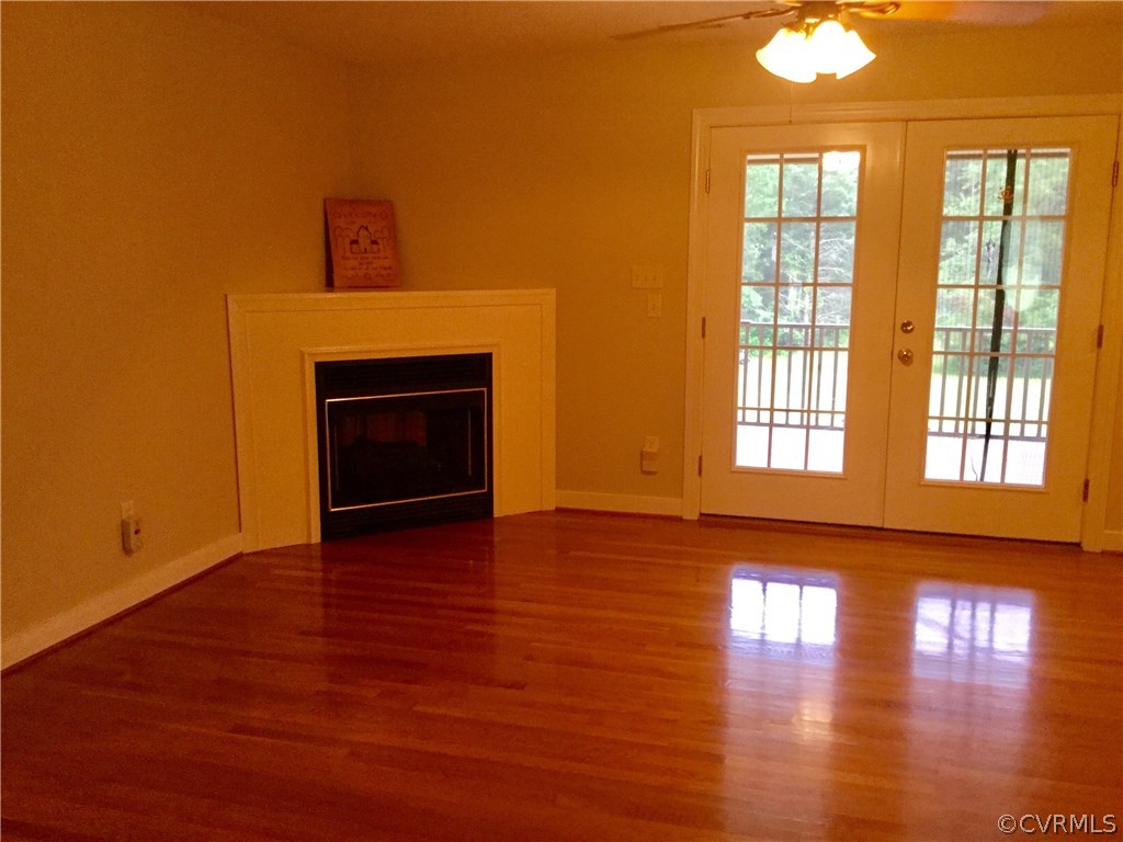 4361 Three Chopt Road Gum Spring, VA 23065 - Photo 18 of 49 a view of an empty room with glass door and wooden floor