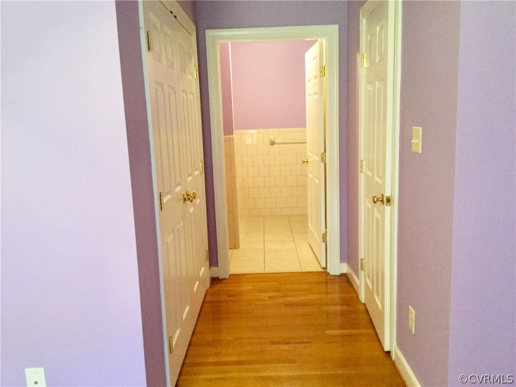 4361 Three Chopt Road Gum Spring, VA 23065 - Photo 36 of 49 a view of a hallway with wooden floor and a bathroom