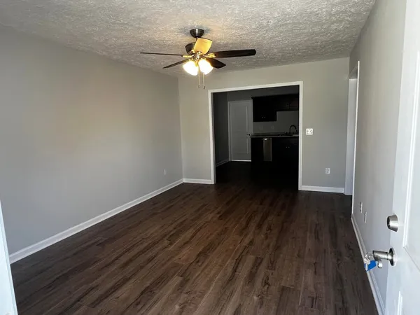 a view of a livingroom with wooden floor