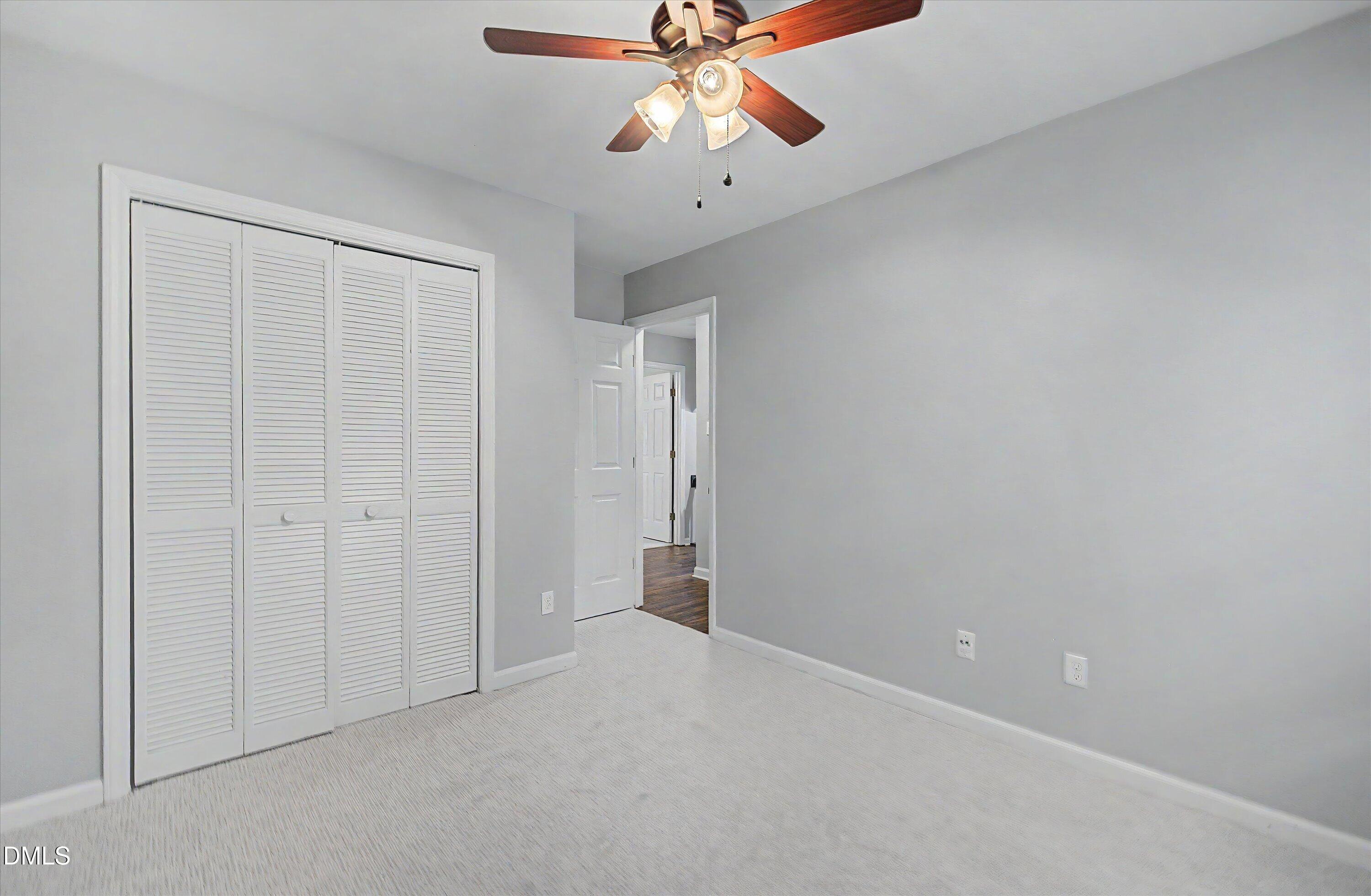 5519 Hamstead Crossing Raleigh, NC 27612 - Photo 26 of 33 a view of an empty room and chandelier fan