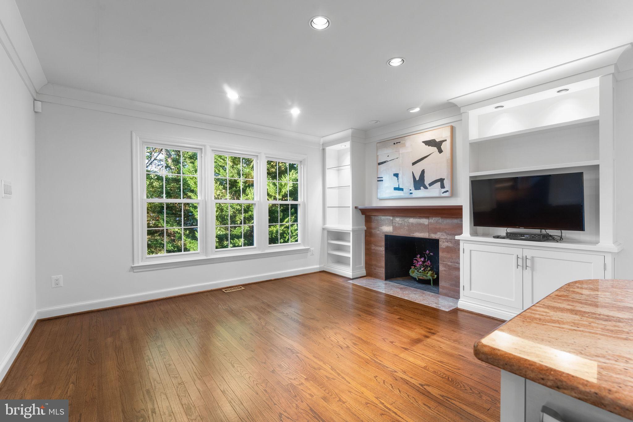 6619 Madison McLean Drive McLean, VA 22101 - Photo 12 of 54 a view of an empty room with a fireplace and a window