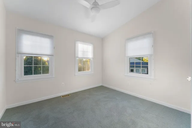 a bathroom with a sink toilet vanity and shower