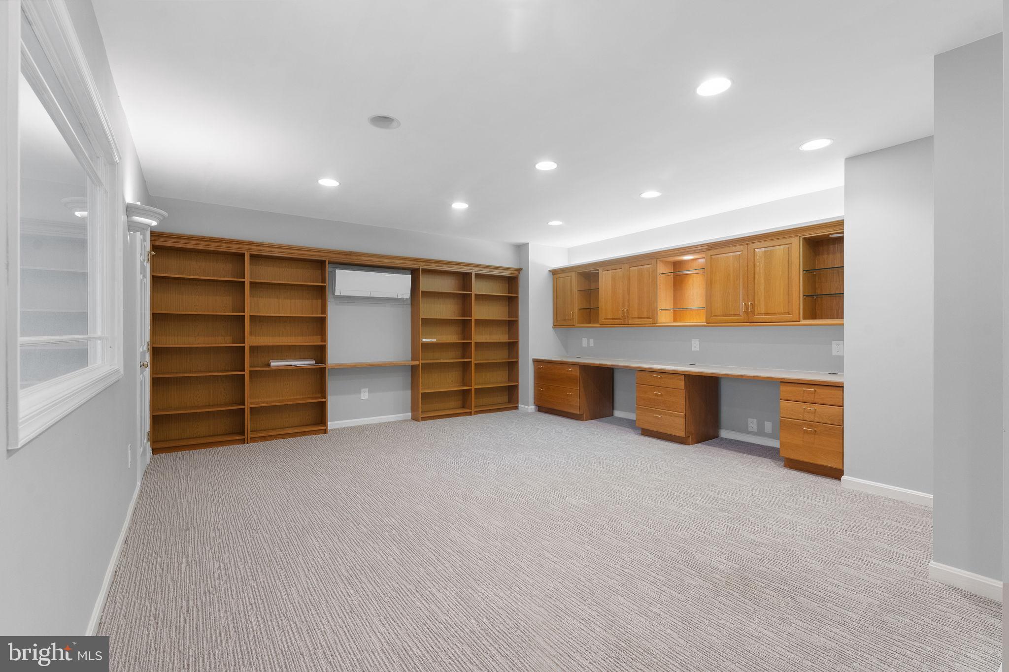 6619 Madison McLean Drive McLean, VA 22101 - Photo 32 of 54 an empty room with a closet and cabinet