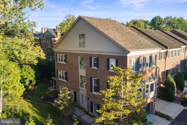 a large kitchen with kitchen island a sink stainless steel appliances and cabinets