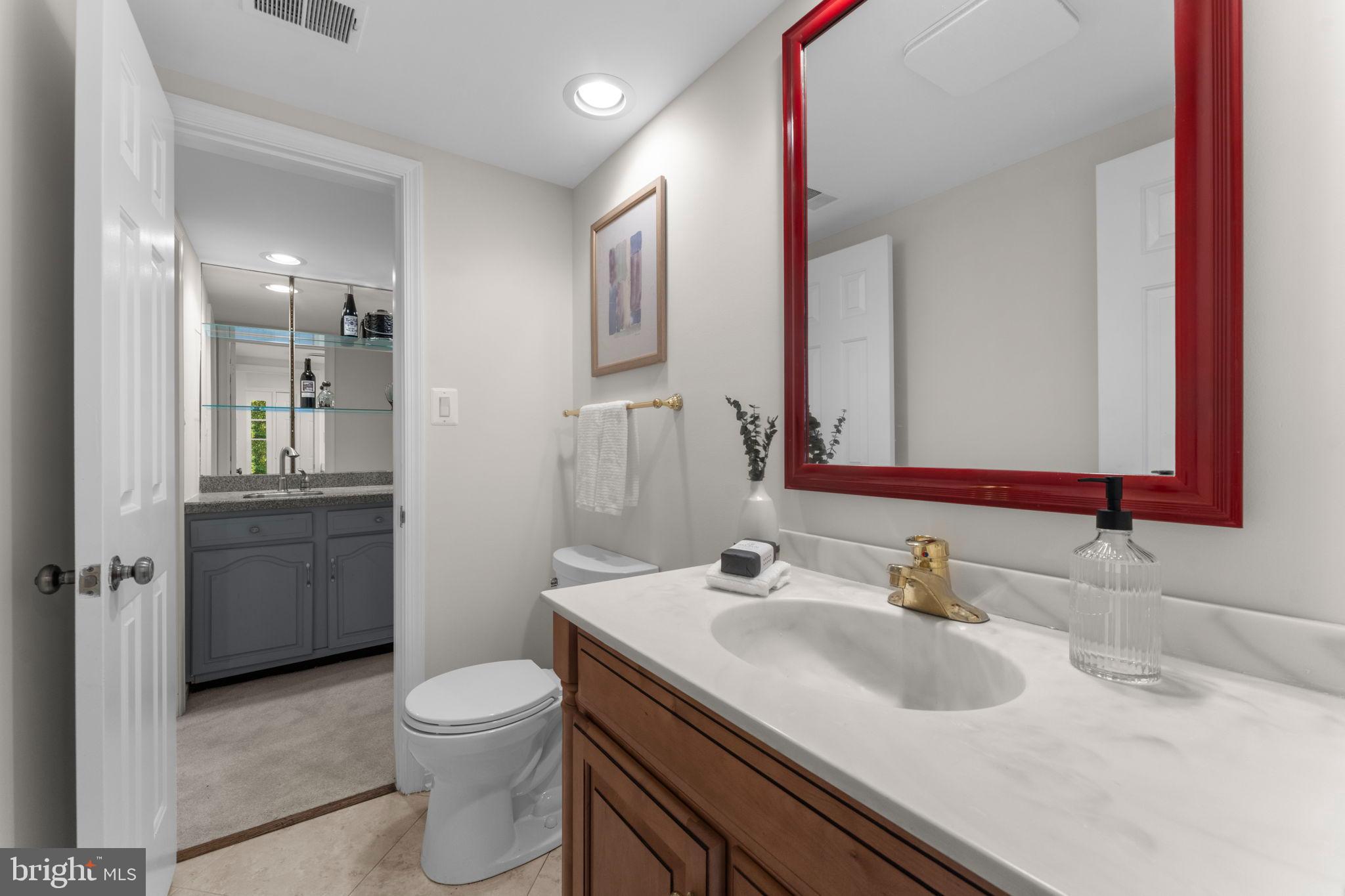 6619 Madison McLean Drive McLean, VA 22101 - Photo 43 of 54 a bathroom with a sink toilet vanity and shower