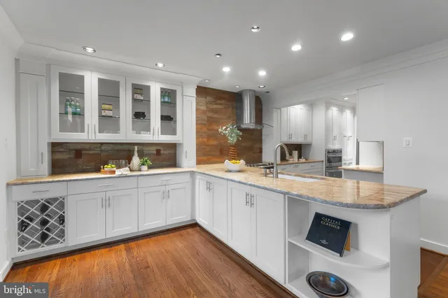 a kitchen with a sink and large window