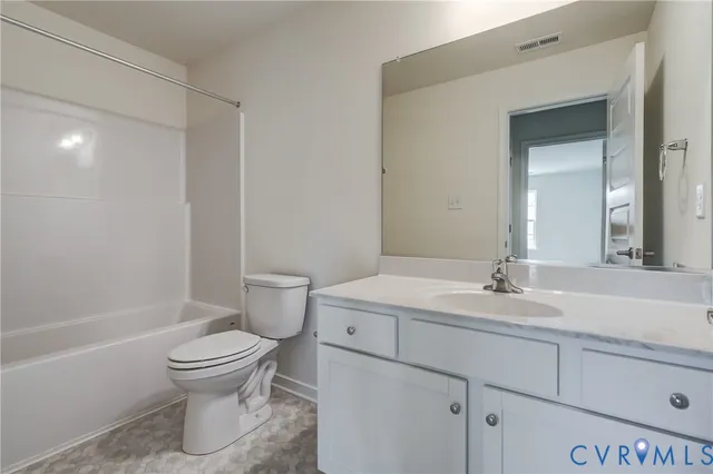 an empty room with sliding door and wooden floor & fence