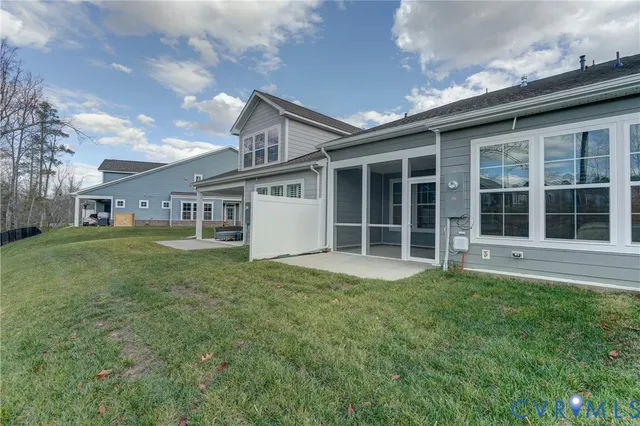 a view of a house with a back yard