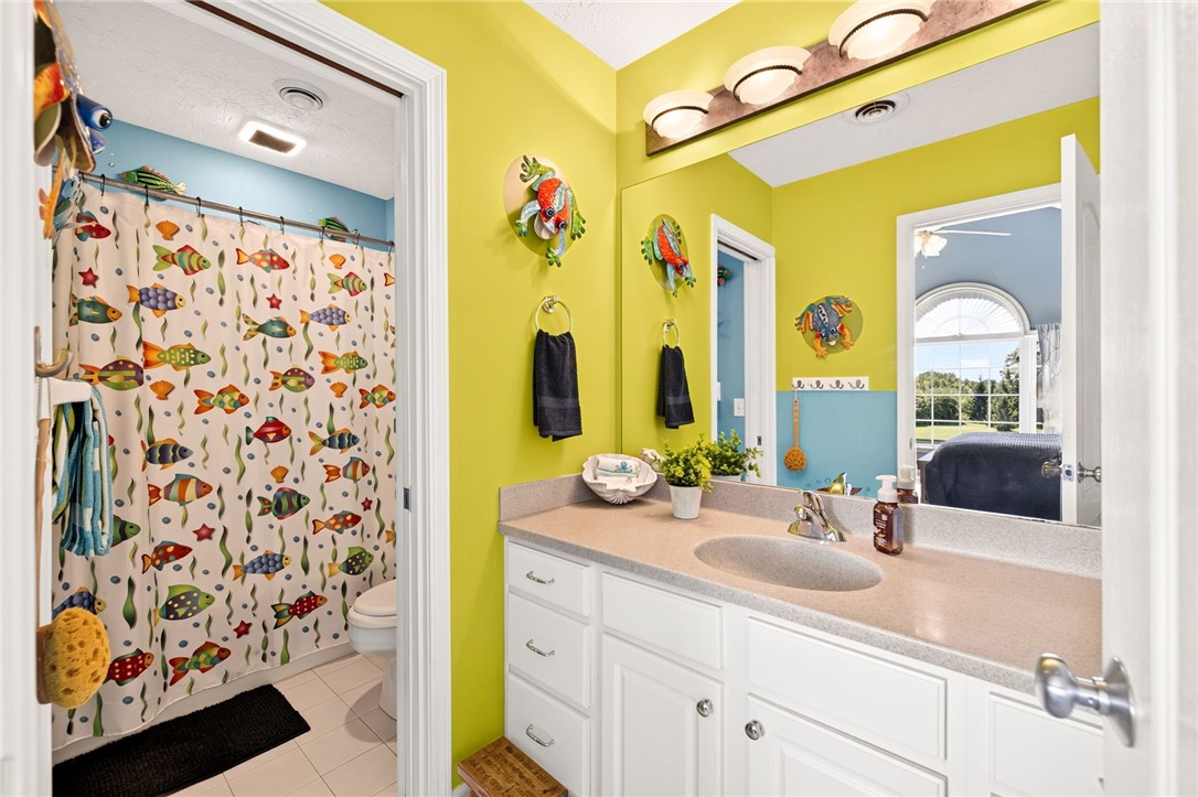 5545 Triphammer Road Avon, NY 14414 - Photo 20 of 50 Jack-and-Jill bathroom conveniently connects the b