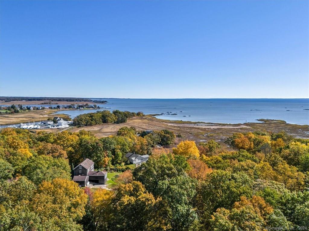 205 Chaffinch Island Road Guilford, CT 06437 - Photo 1 of 1 an aerial view of ocean and residential houses with outdoor space
