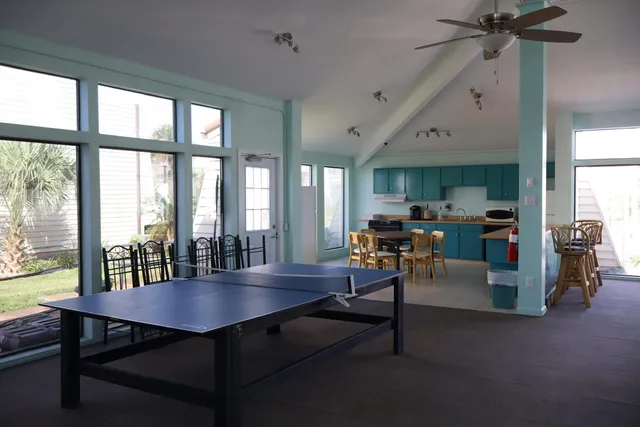 a view of a dining room with furniture and a window