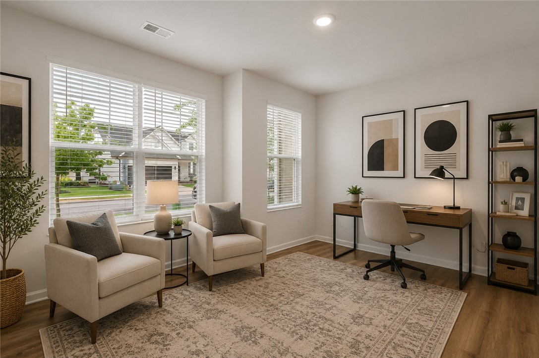 8 Leander Drive Greer, SC 29651 - Photo 5 of 31 Sun-filled room with hard flooring and white walls offers a versatile space for work or relaxation.
