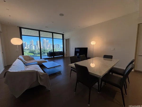 a view of a dining room with furniture and window