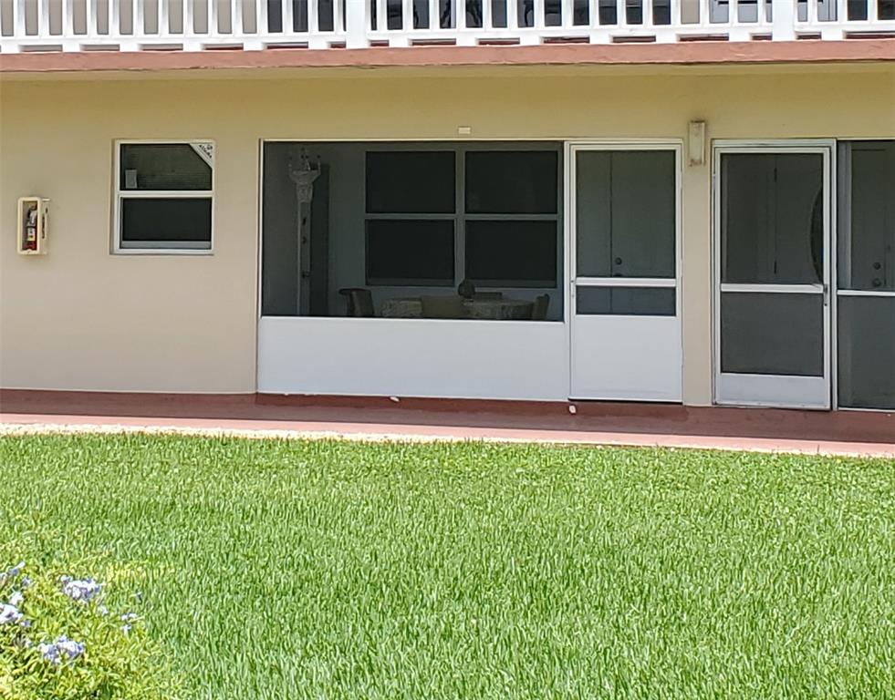 5300 Washington Street, Unit 114C Hollywood, FL 33021 - Photo 2 of 25 a view of front door of house with yard