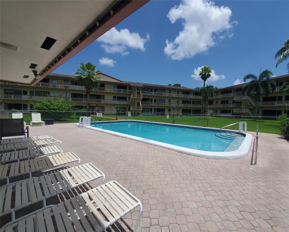5300 Washington Street, Unit 114C Hollywood, FL 33021 - Photo 22 of 25 a view of a swimming pool with a patio