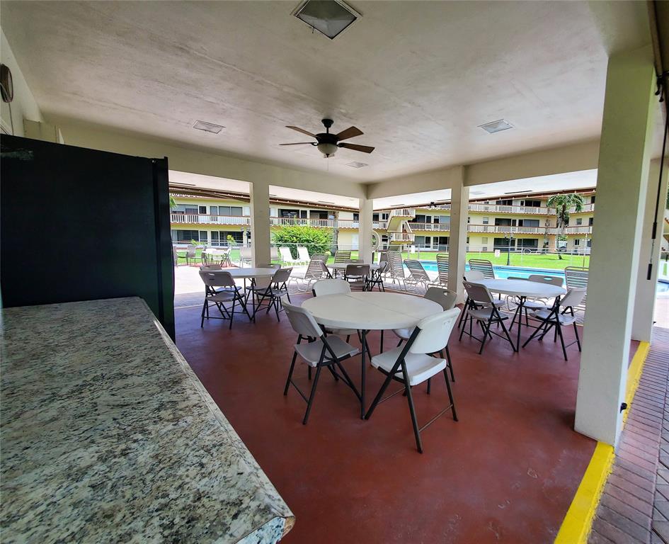 5300 Washington Street, Unit 114C Hollywood, FL 33021 - Photo 24 of 25 a view of a dining room with furniture