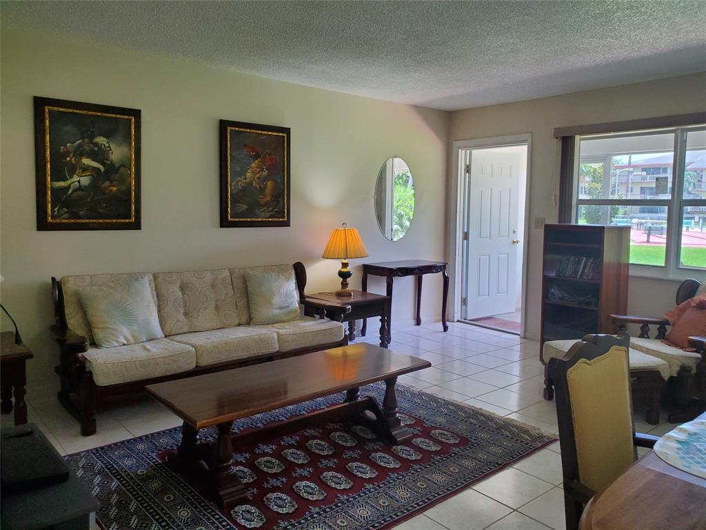 5300 Washington Street, Unit 114C Hollywood, FL 33021 - Photo 4 of 25 a living room with furniture and a window