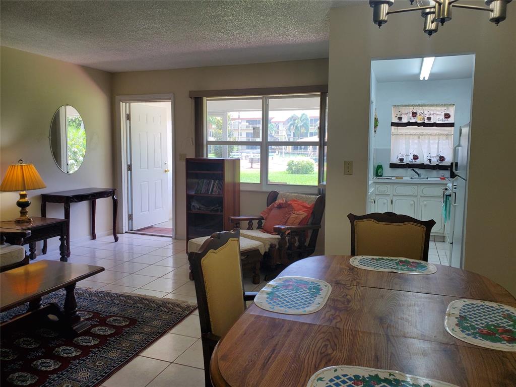 5300 Washington Street, Unit 114C Hollywood, FL 33021 - Photo 9 of 25 a living room with furniture and a window