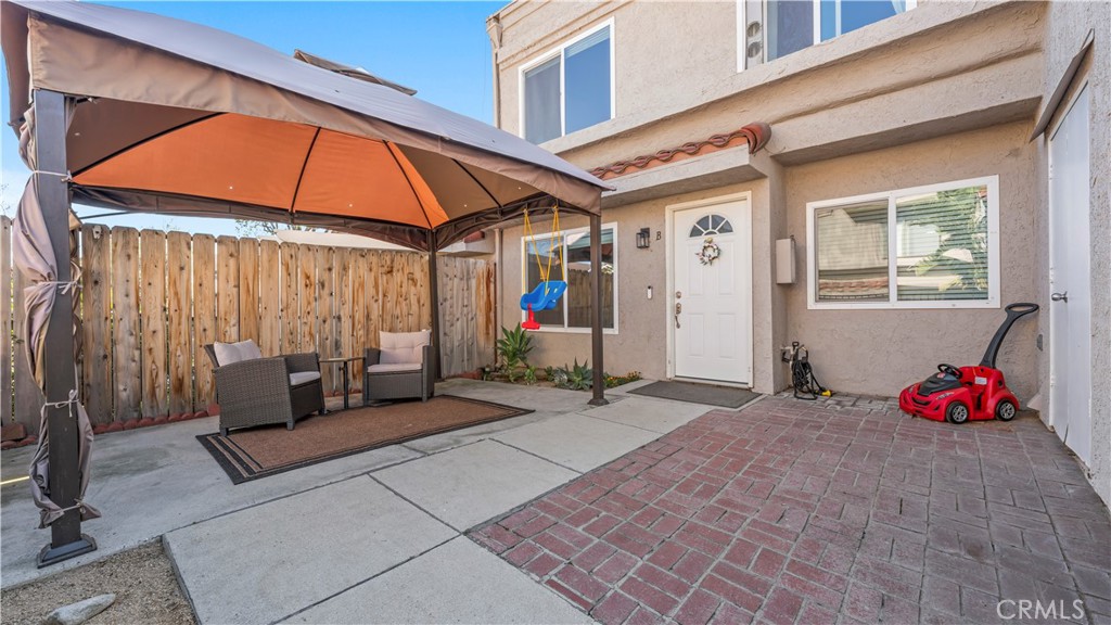 9713 La Jolla Drive, Unit B Rancho Cucamonga, CA 91701 - Photo 1 of 23 a backyard of a house with seating space