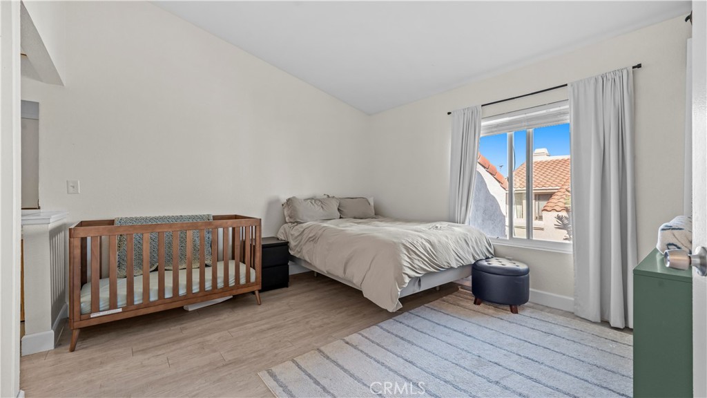 9713 La Jolla Drive, Unit B Rancho Cucamonga, CA 91701 - Photo 11 of 23 a bedroom with a bed and a window