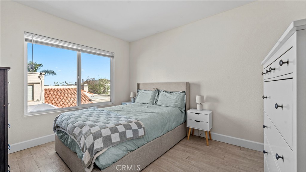 9713 La Jolla Drive, Unit B Rancho Cucamonga, CA 91701 - Photo 14 of 23 a bedroom with a bed and a window