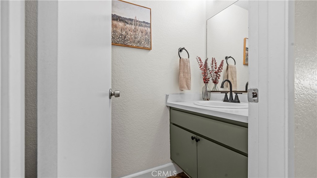 9713 La Jolla Drive, Unit B Rancho Cucamonga, CA 91701 - Photo 15 of 23 a bathroom with a sink and a mirror