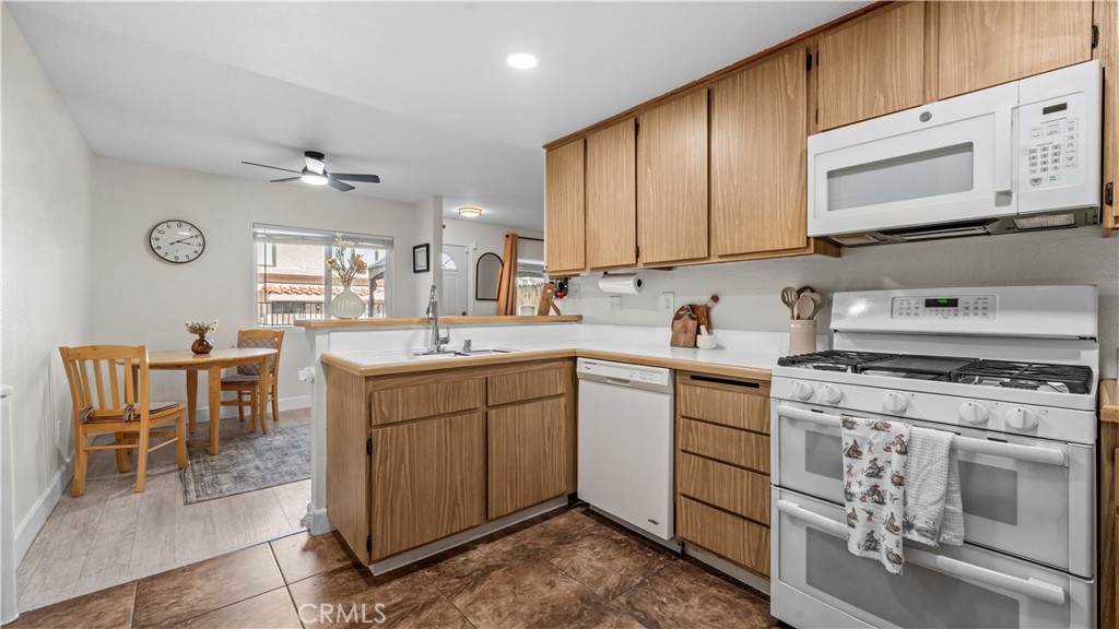 9713 La Jolla Drive, Unit B Rancho Cucamonga, CA 91701 - Photo 18 of 23 a kitchen with a stove cabinets and a sink