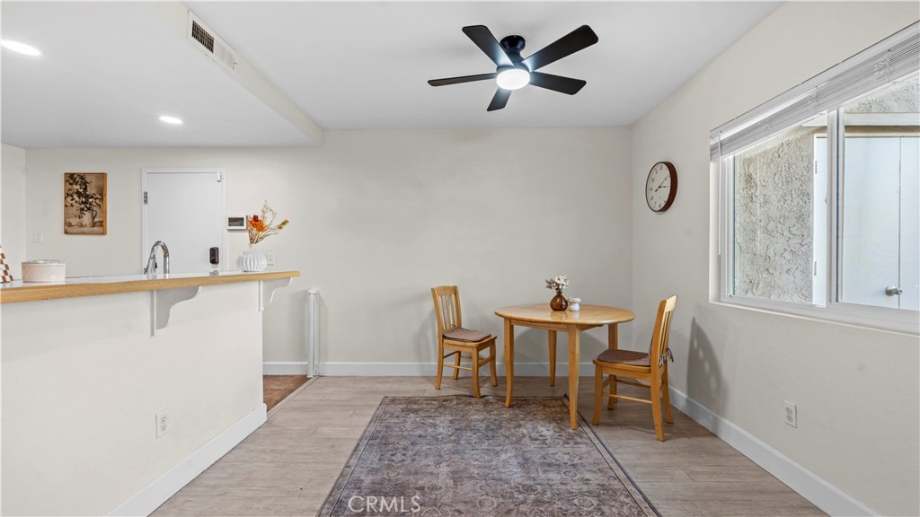 9713 La Jolla Drive, Unit B Rancho Cucamonga, CA 91701 - Photo 19 of 23 a view of a kitchen with a dining table and chairs