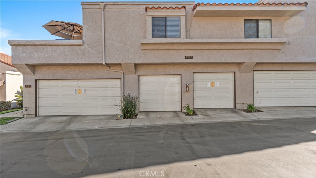 9713 La Jolla Drive, Unit B Rancho Cucamonga, CA 91701 - Photo 4 of 23 a front view of a house with garage