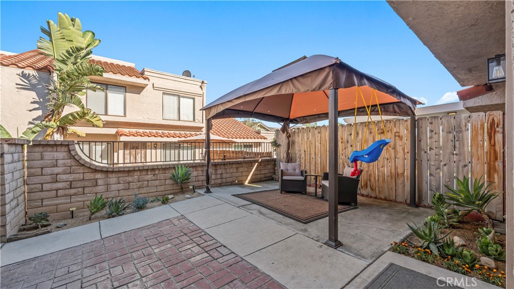 9713 La Jolla Drive, Unit B Rancho Cucamonga, CA 91701 - Photo 5 of 23 a blue bench sitting in front of a building