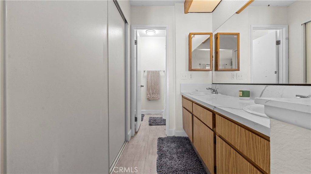 9713 La Jolla Drive, Unit B Rancho Cucamonga, CA 91701 - Photo 9 of 23 a bathroom with a double vanity sink and a mirror