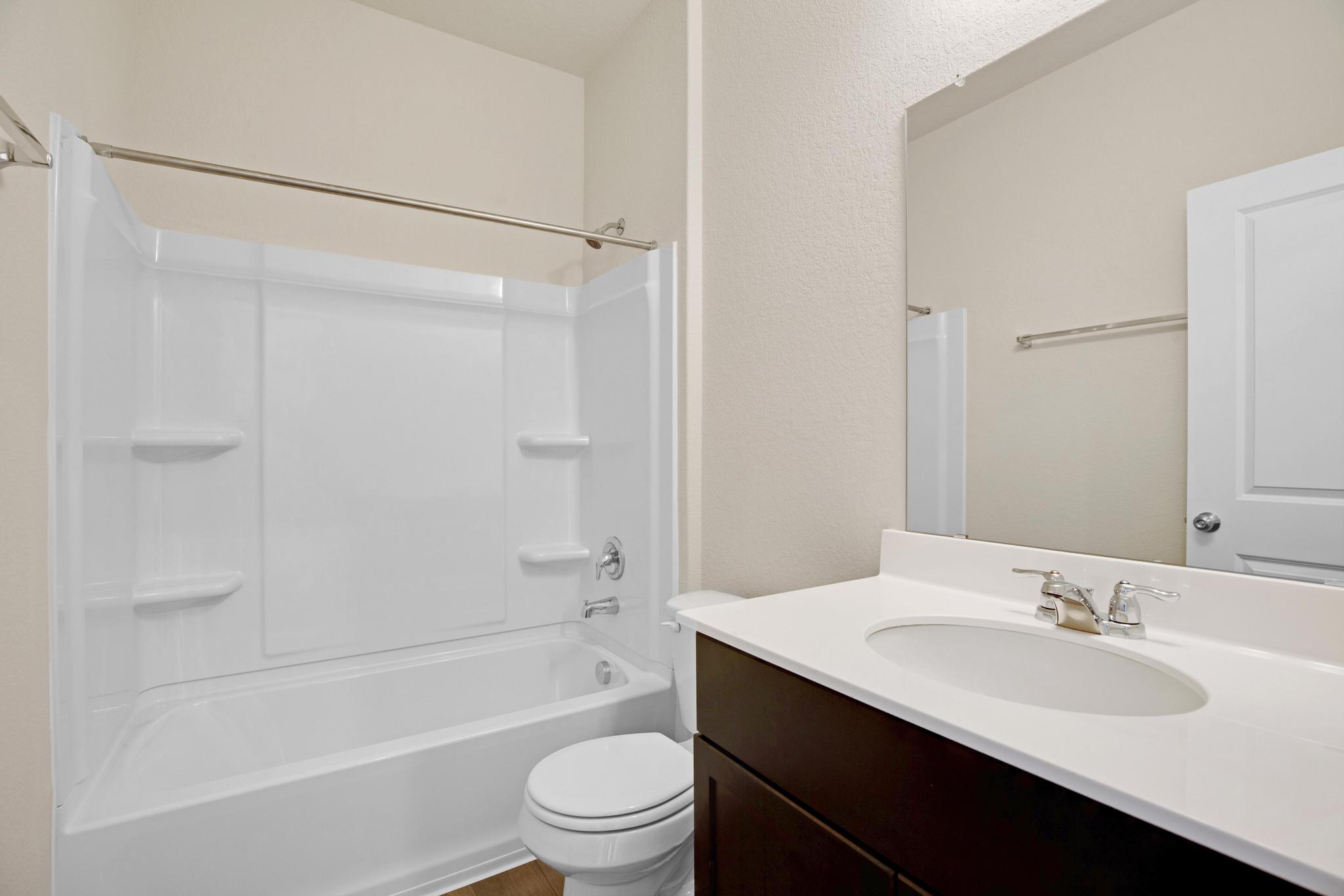200 Janice Road Taylor, TX 76574 - Photo 20 of 25 A well-maintained bathroom with a spacious tub and a sleek vanity.