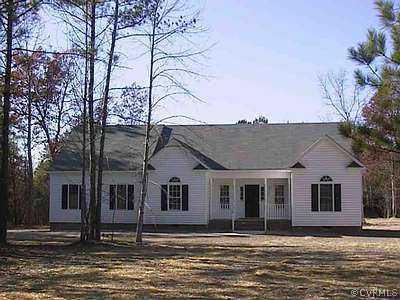a house that has a tree in front of it