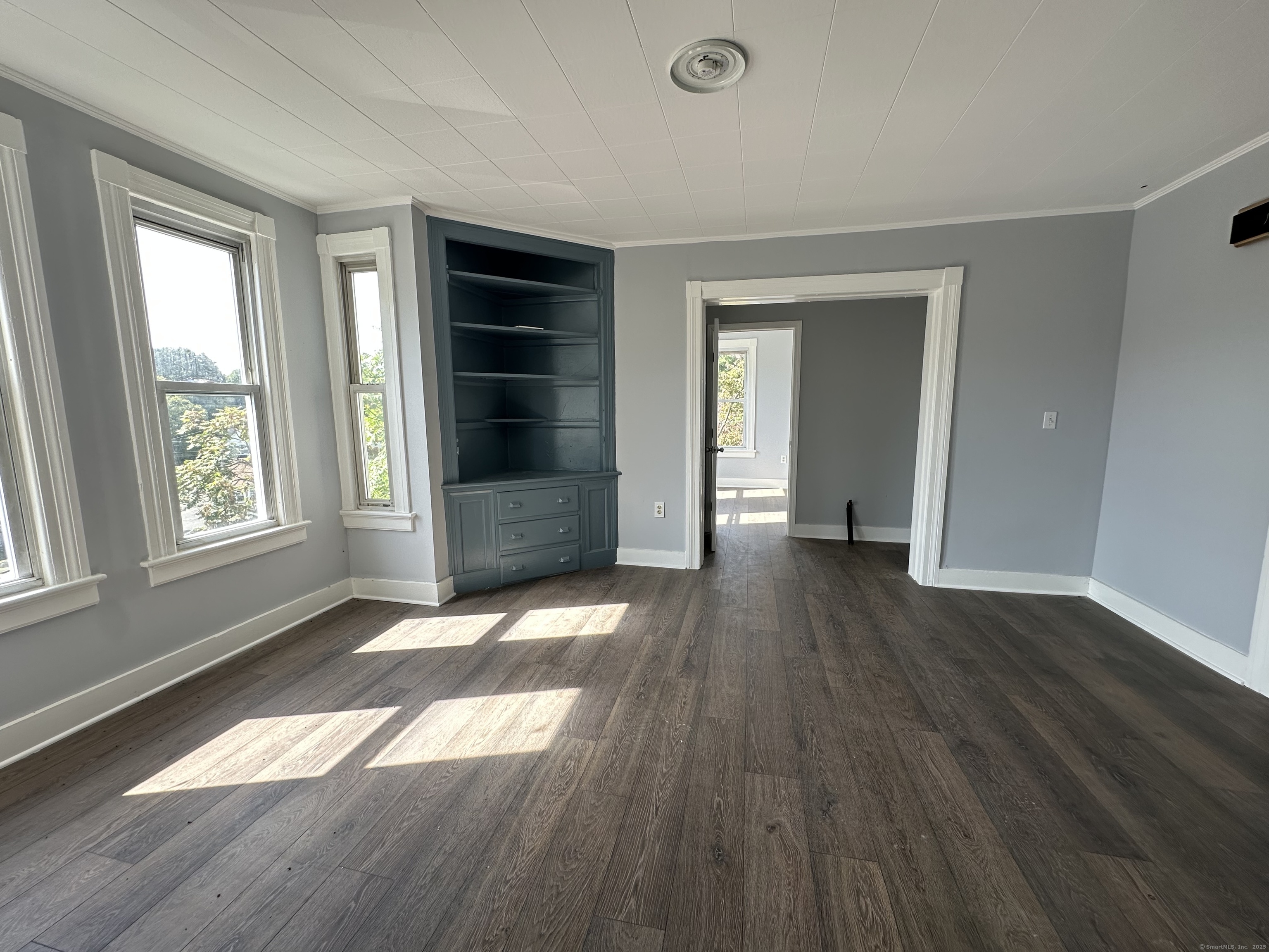 12 Rockwood Avenue Ansonia, CT 06401 - Photo 13 of 15 an empty room with wooden floor and windows