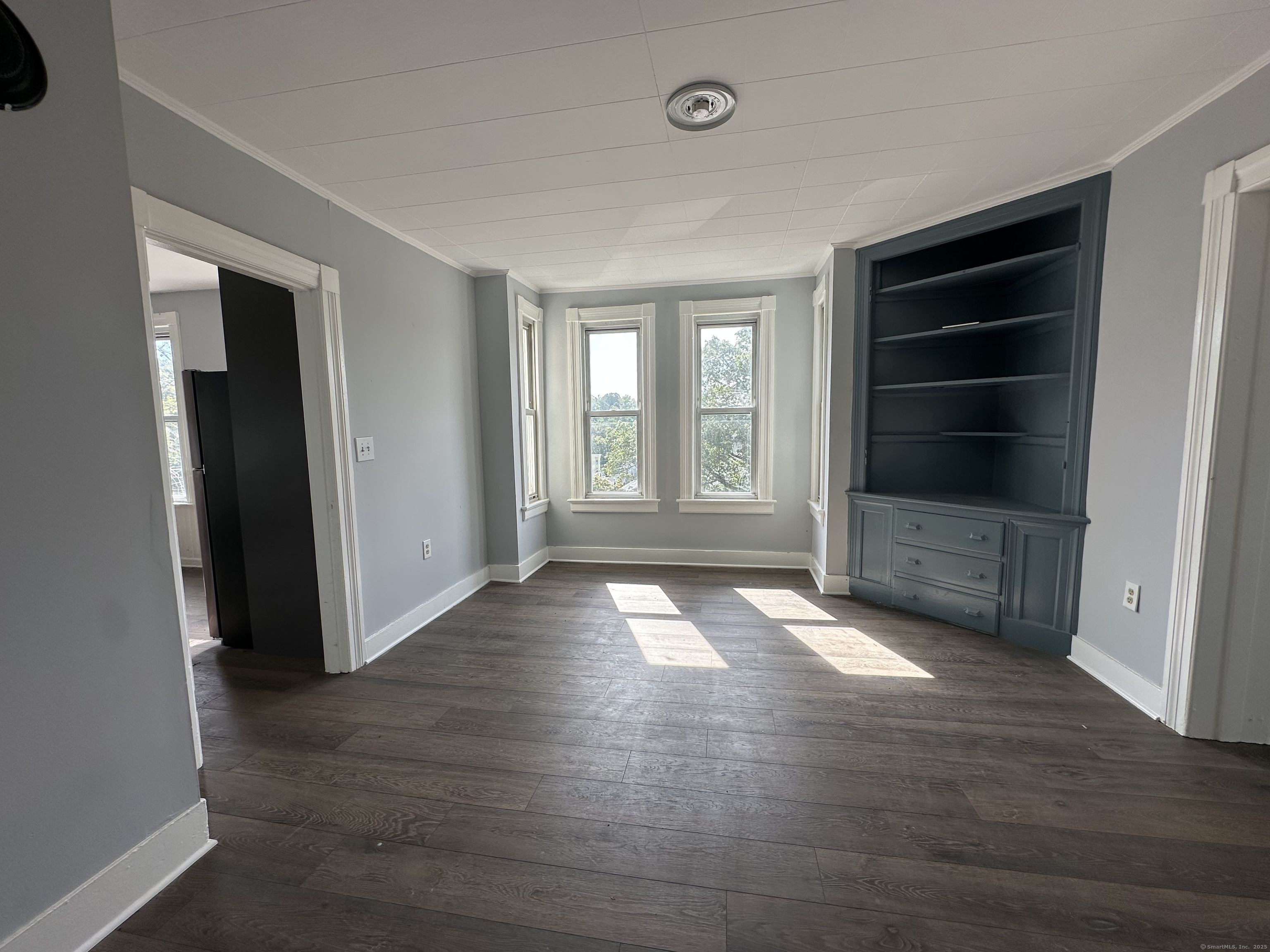 12 Rockwood Avenue Ansonia, CT 06401 - Photo 14 of 15 an empty room with wooden floor and windows