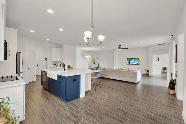 a view of kitchen center island and living room