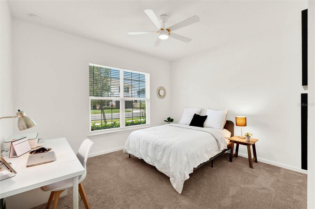 533 Avila Place Howey-in-the-Hills, FL 34737 - Photo 19 of 42 a bedroom with a bed and a window