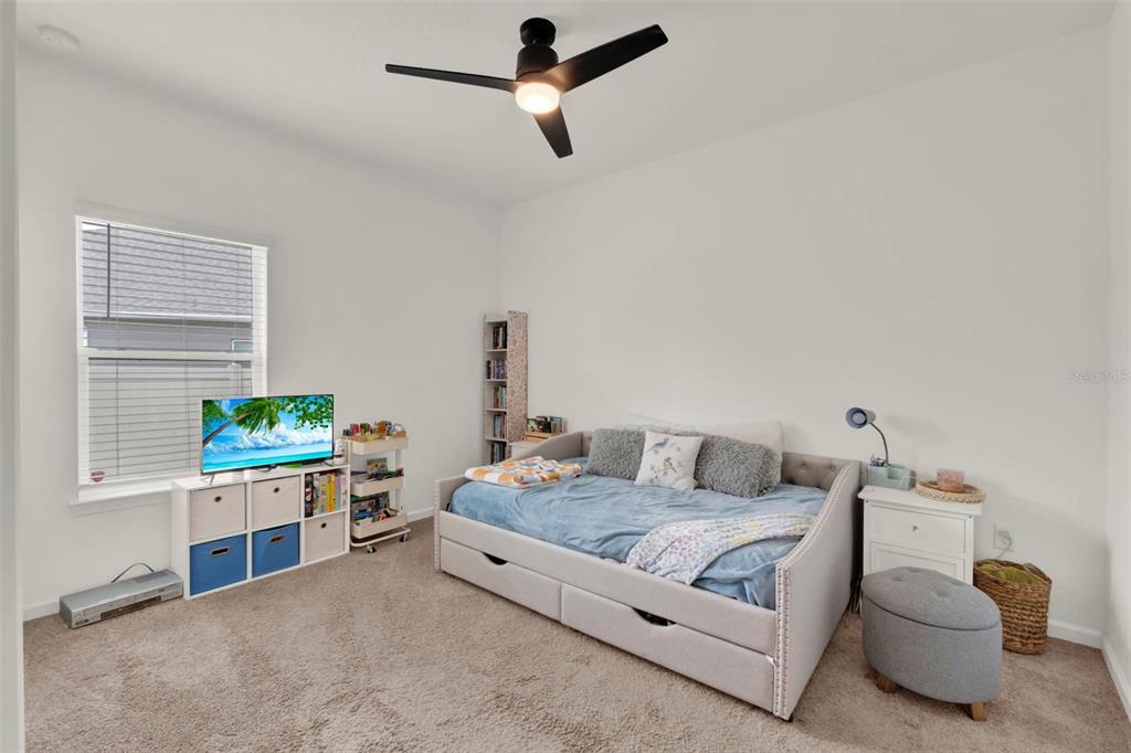 533 Avila Place Howey-in-the-Hills, FL 34737 - Photo 21 of 42 a living room with furniture and a window