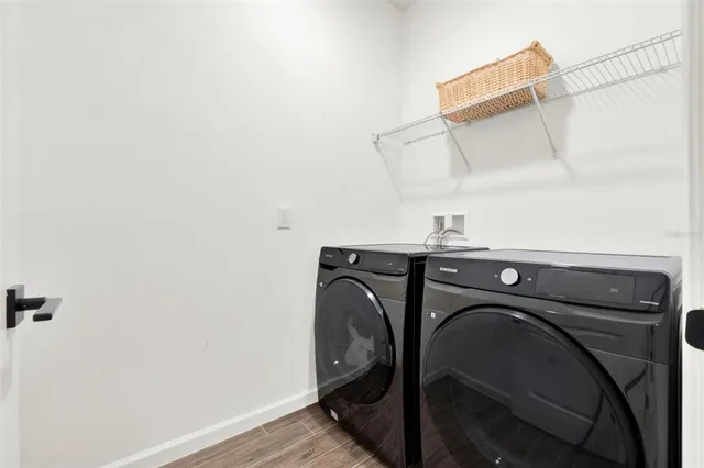 a view of hallway with wooden floor