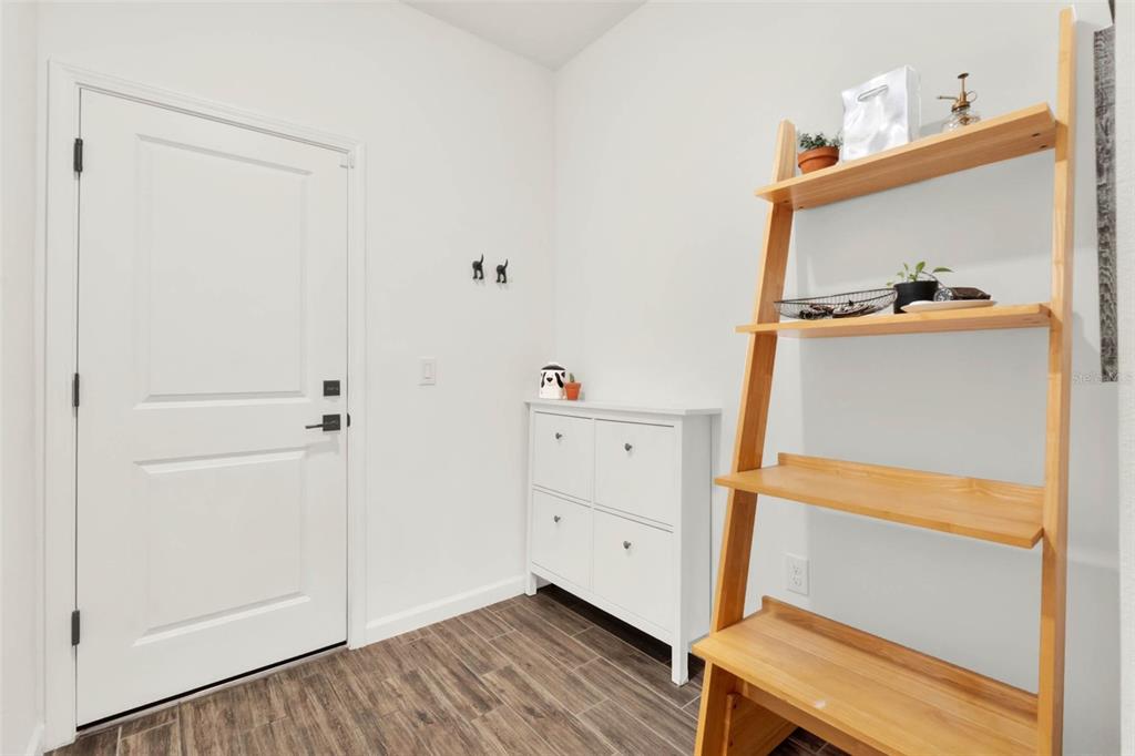533 Avila Place Howey-in-the-Hills, FL 34737 - Photo 29 of 42 a view of hallway with wooden floor