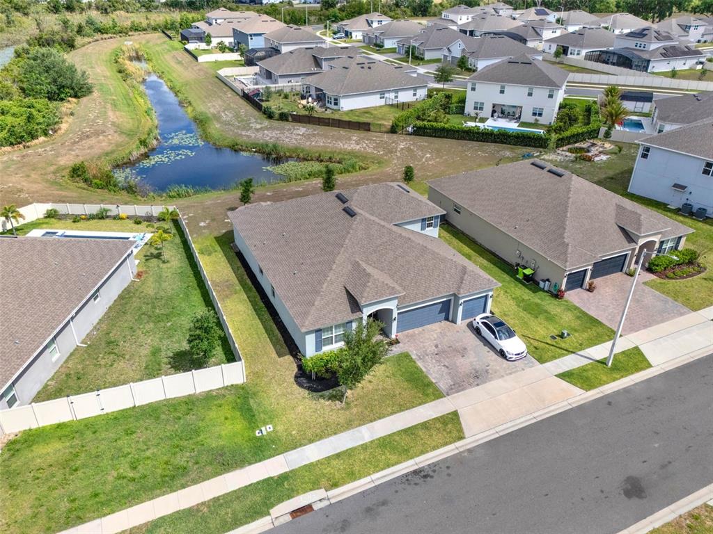 533 Avila Place Howey-in-the-Hills, FL 34737 - Photo 37 of 42 an aerial view of residential houses with outdoor space and street view