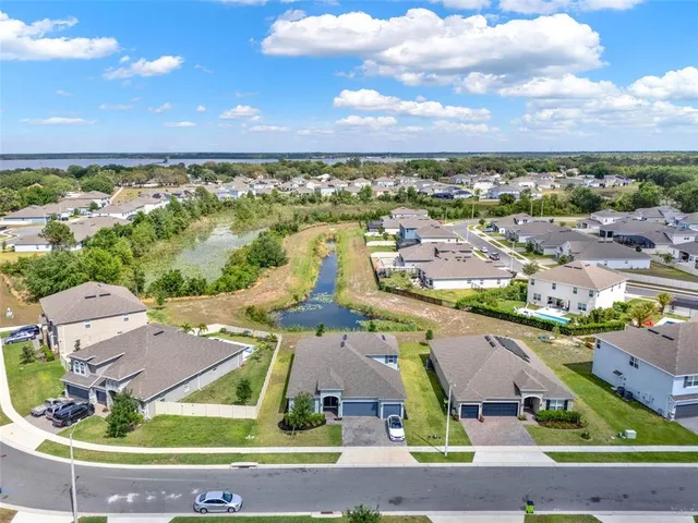 a view of a city with lots of residential buildings and ocean view