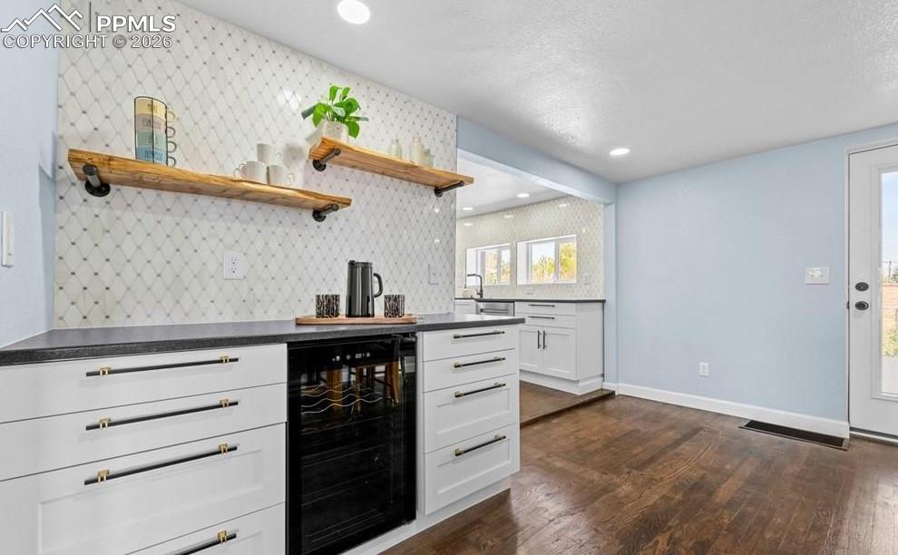29767 Preston Road Pueblo, CO 81006 - Photo 13 of 50 a kitchen with a stove cabinets and wooden floor
