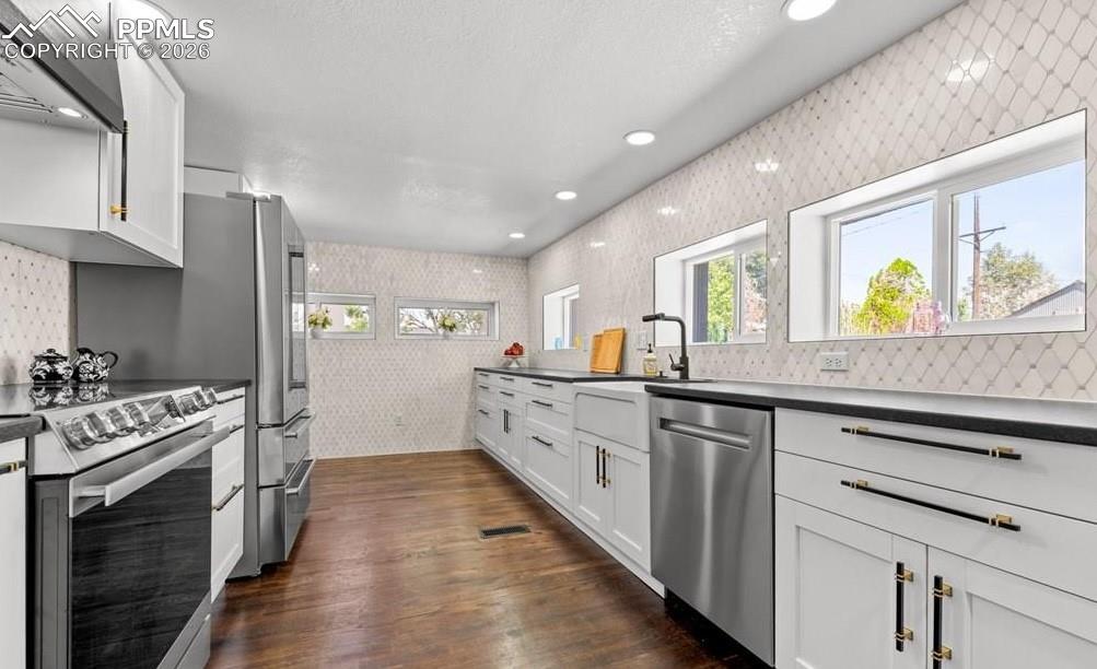 29767 Preston Road Pueblo, CO 81006 - Photo 17 of 50 a kitchen with stainless steel appliances a stove top oven and sink