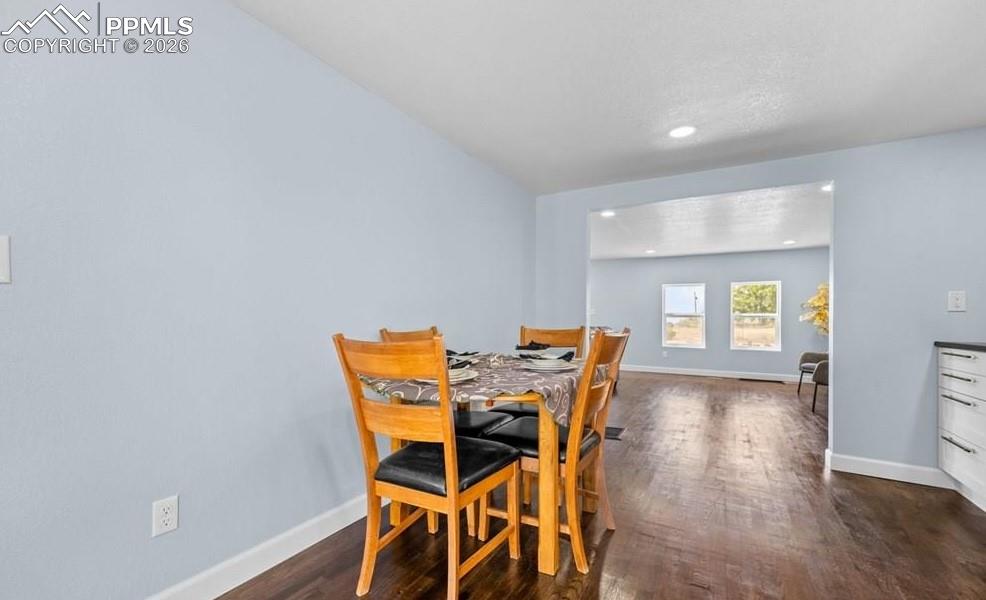 29767 Preston Road Pueblo, CO 81006 - Photo 23 of 50 a view of a dining room with furniture and wooden floor