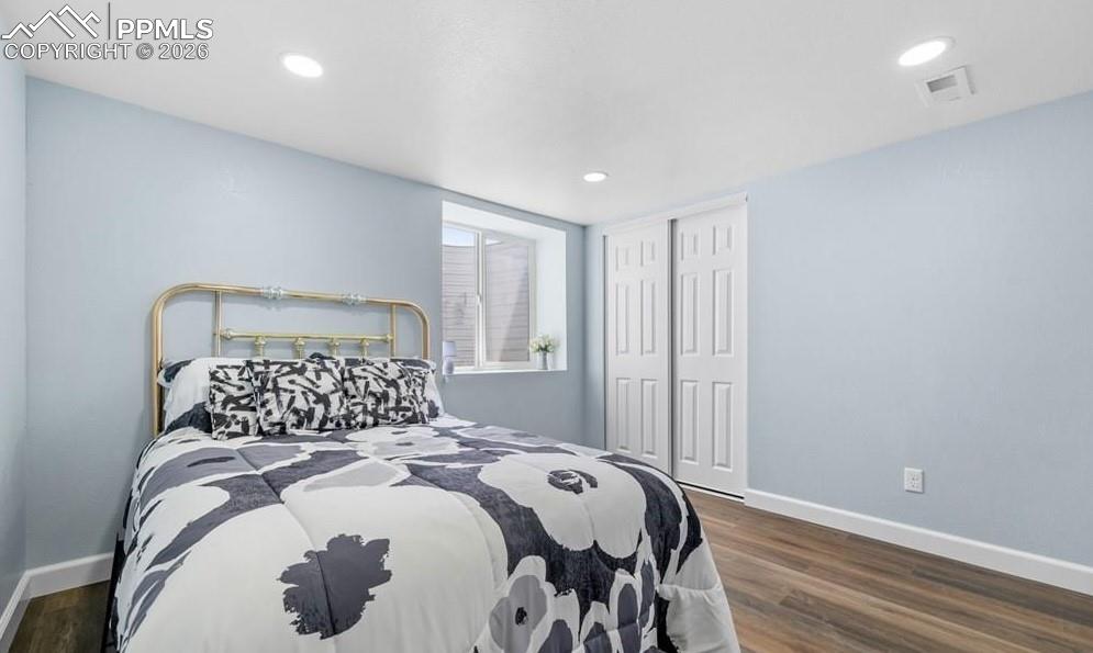 29767 Preston Road Pueblo, CO 81006 - Photo 39 of 50 a bedroom with a bed and a lamp